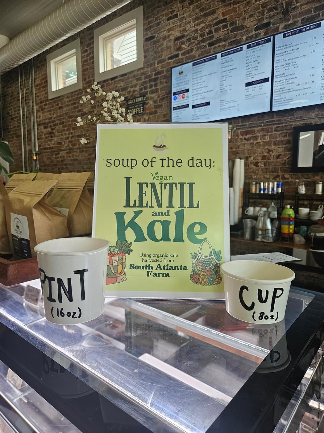 A soup of the day sign for lentil and kale soup that names South Atlanta Farms